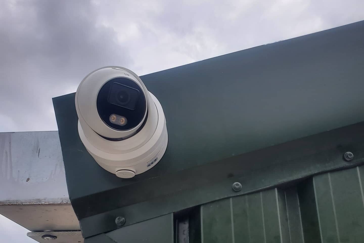 Dome CCTV camera mounted under a commercial unit canopy